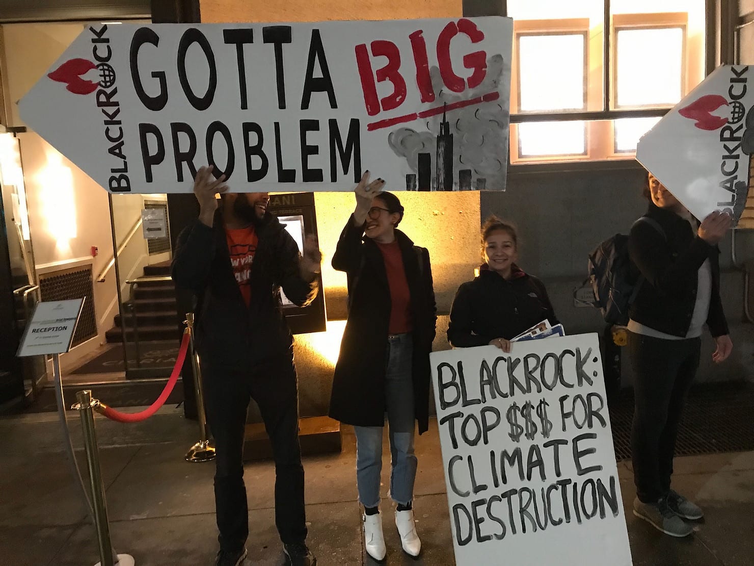 Activists outside an event, following BlackRock CEO Larry Fink