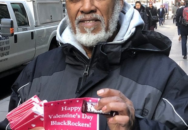 Activist hands out special valentines to BlackRock employees.