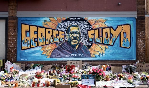 Mural and flowers honoring George Floyd