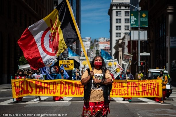 Activists march through downtown San Francisco to the BlackRock office