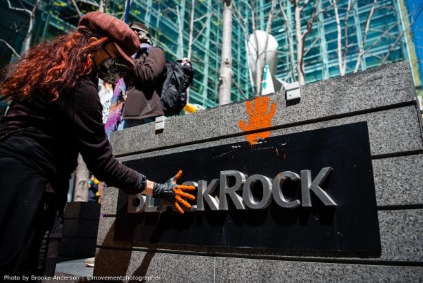 Activists paint bloody hands on BlackRock office
